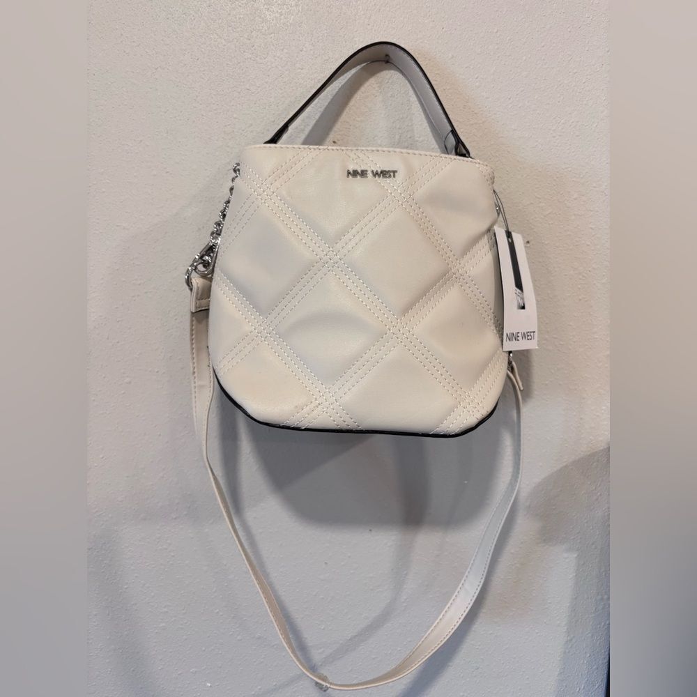 Nine West Skyes Bucket Crossbody bag in the color Milk , Quilted,